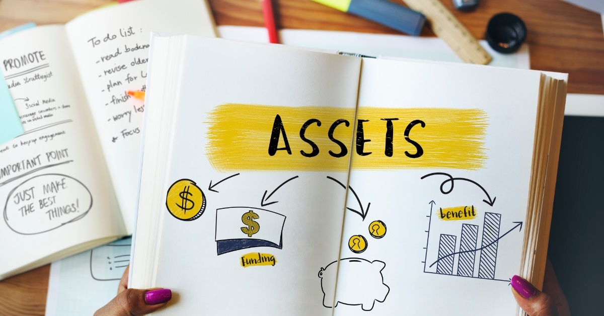 notebook having assets written over page