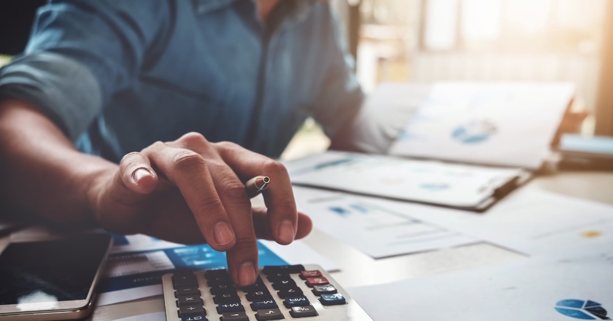 businessman calculating budget at work