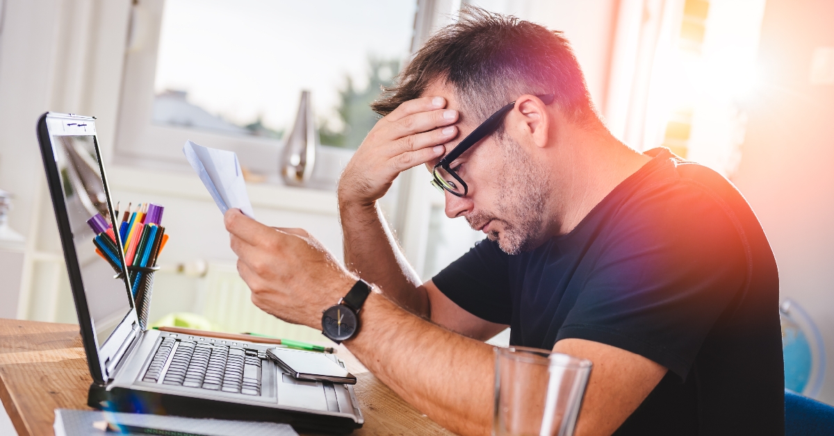 man reading letter and felling worried
