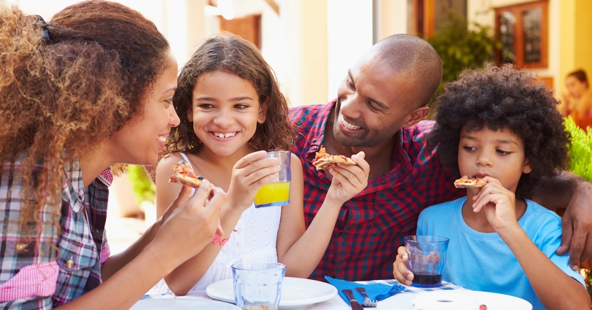 family eating meal at restaurant