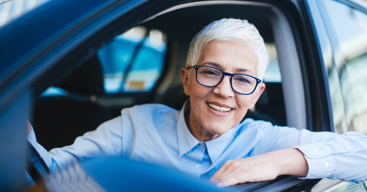 mature woman at car