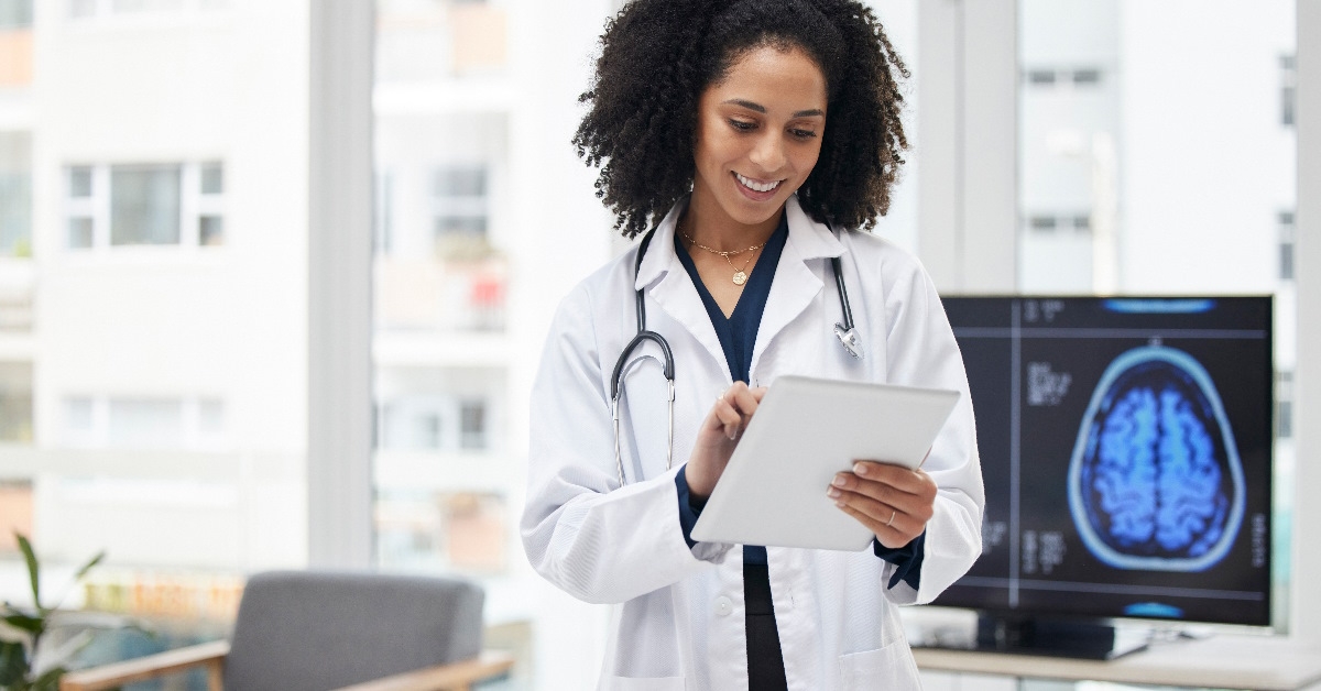 Neuro Surgeon planning surgery with tablet in office