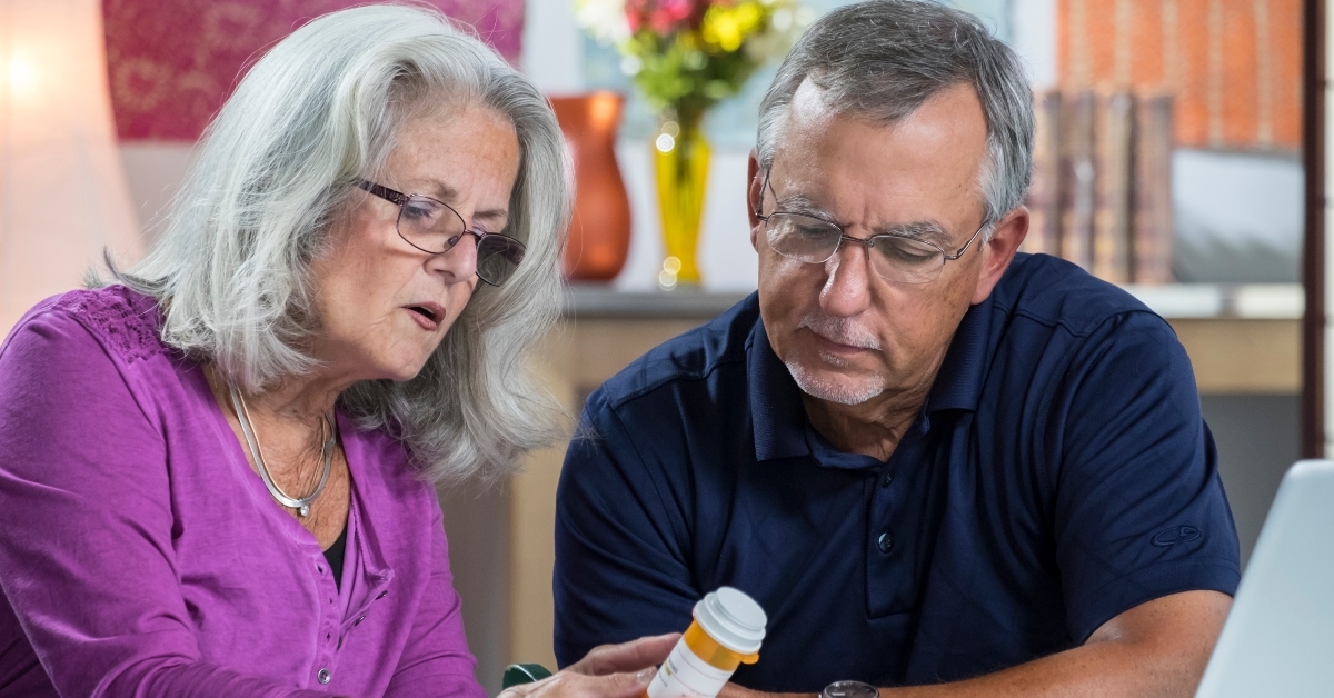 aged couple reading the label