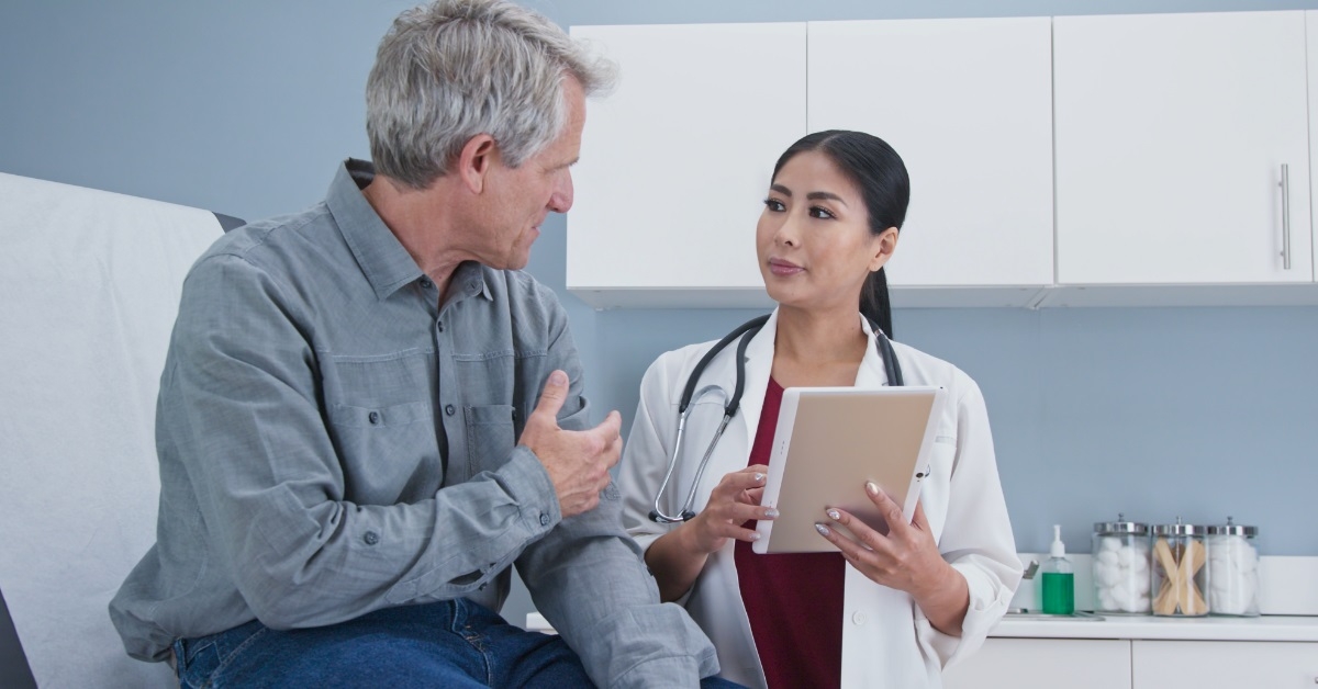 patient giving history to female nurse