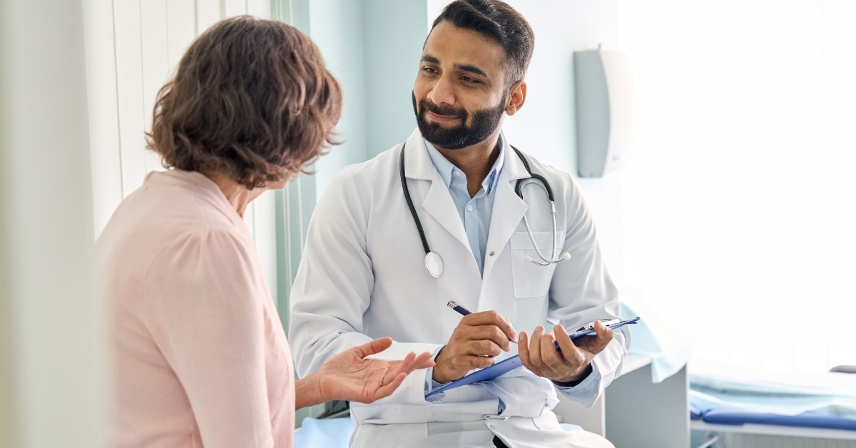 senior woman consulting young male doctor