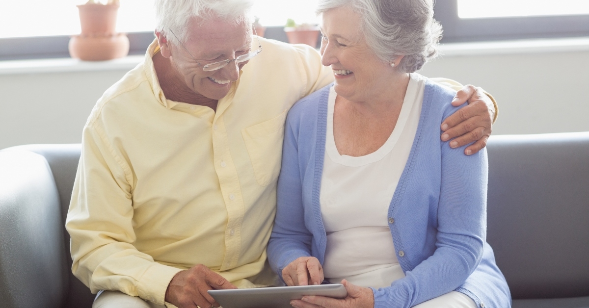 senior couple using a tablet