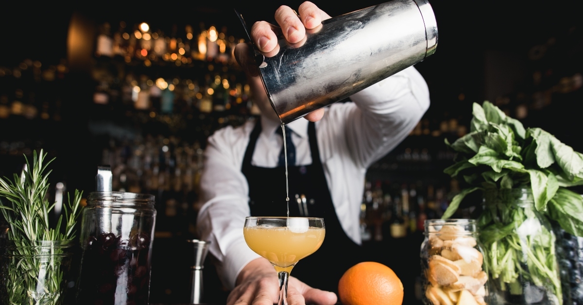 bartender pouring cocktail