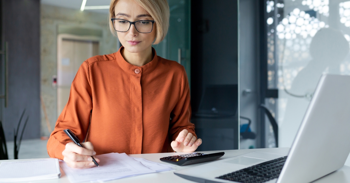 businesswoman behind paper work