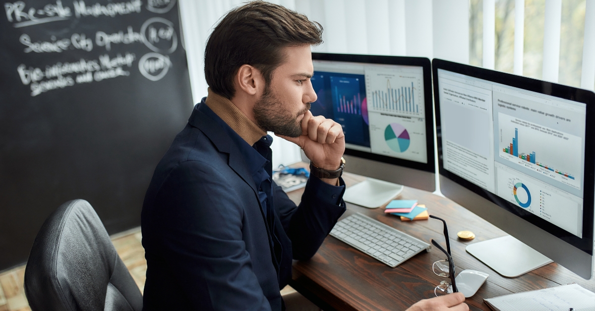 financial analyst holding eyeglasses