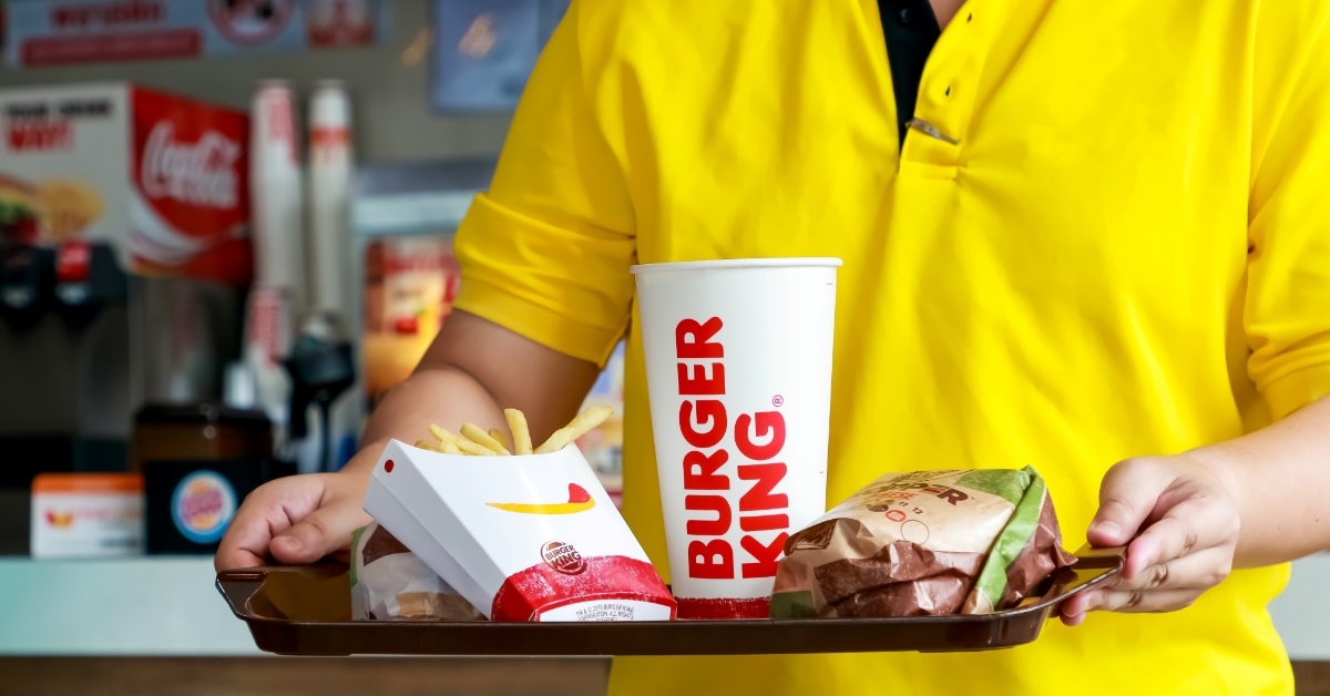 man holding burger king meal tray