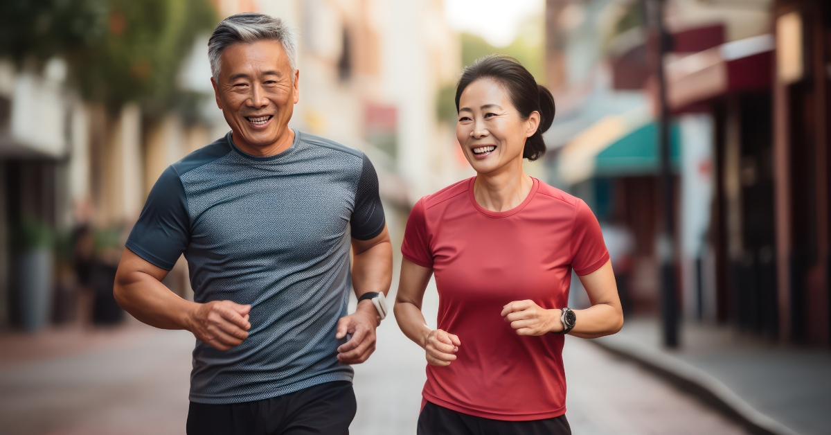 middle-aged Asian couple jogging