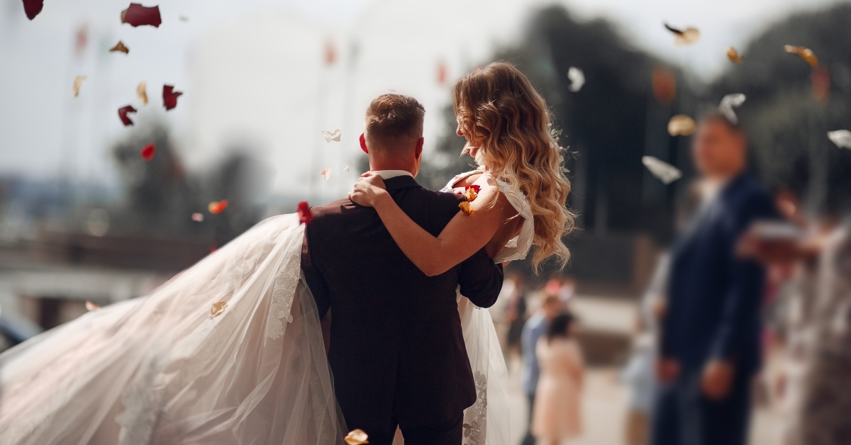 rose petals over a wedded couple