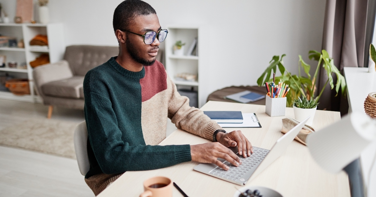 man wearing glasses while working