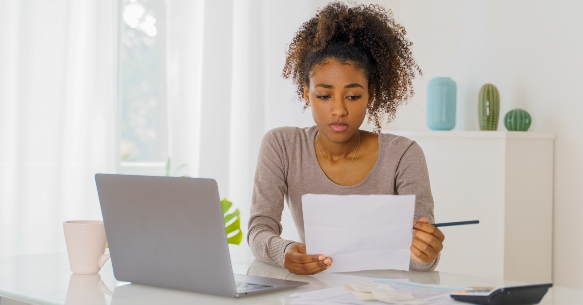 stressed african american woman reviewing documents