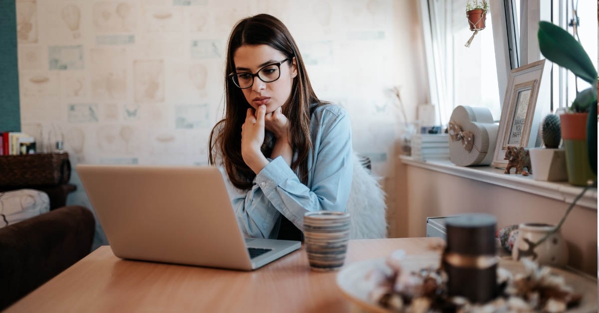 young girl confused at laptop screen