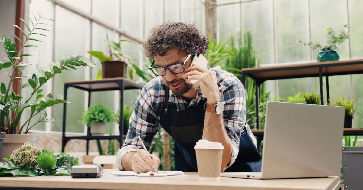 businessman talking on phone at work