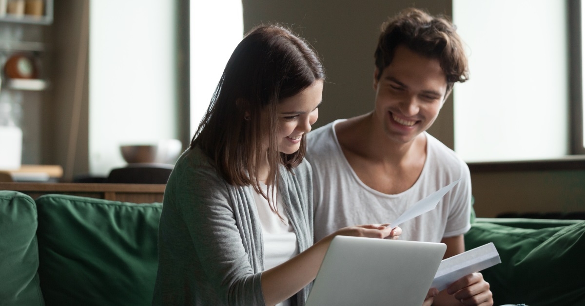happy couple reviewing bills together