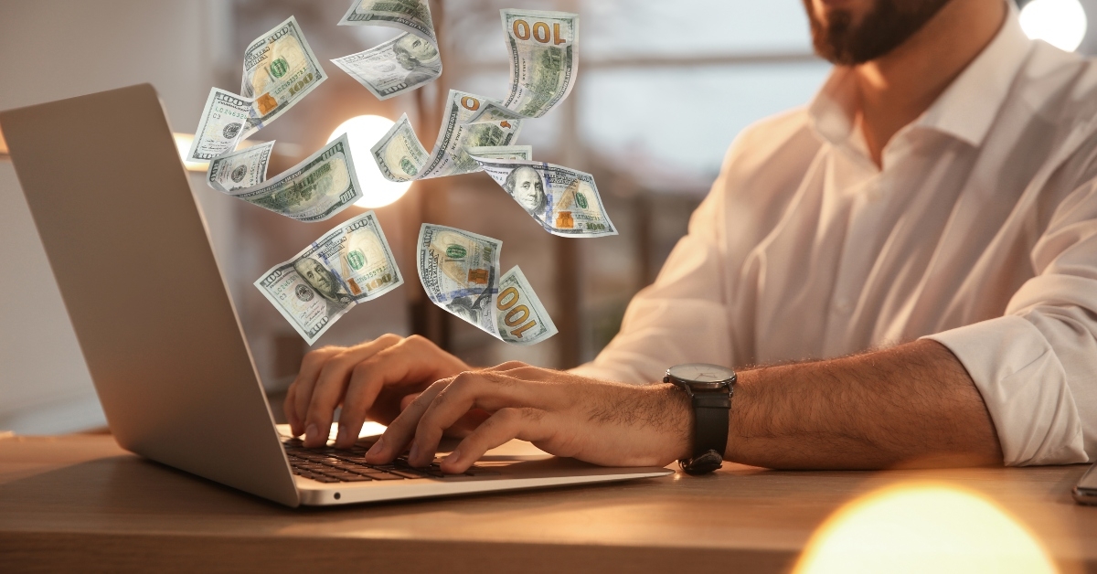 man using laptop at table
