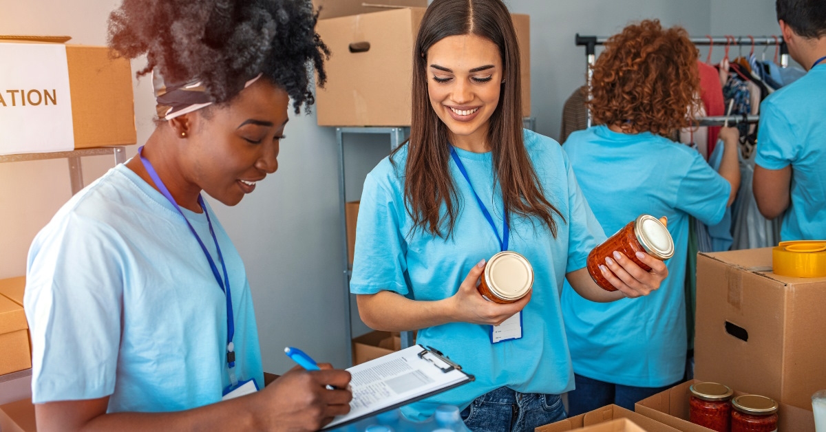 multi ethnic volunteers preparing donation boxes