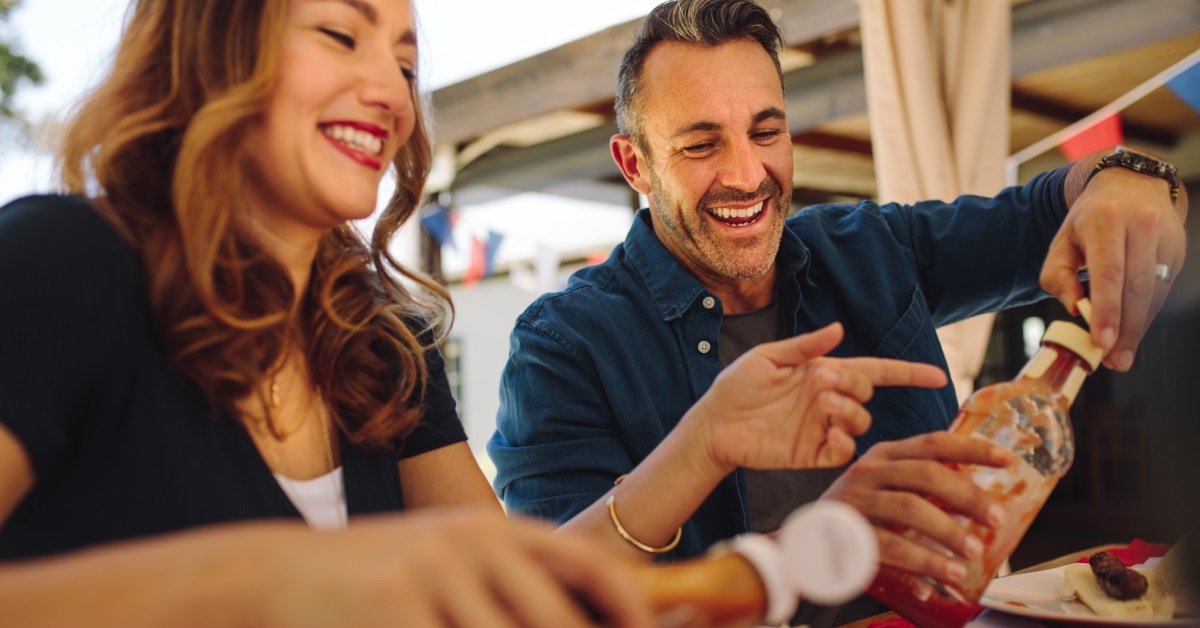happy couple having lunch in restaurant