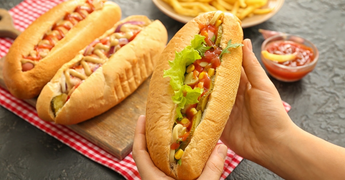 tasty hot dogs platter at table