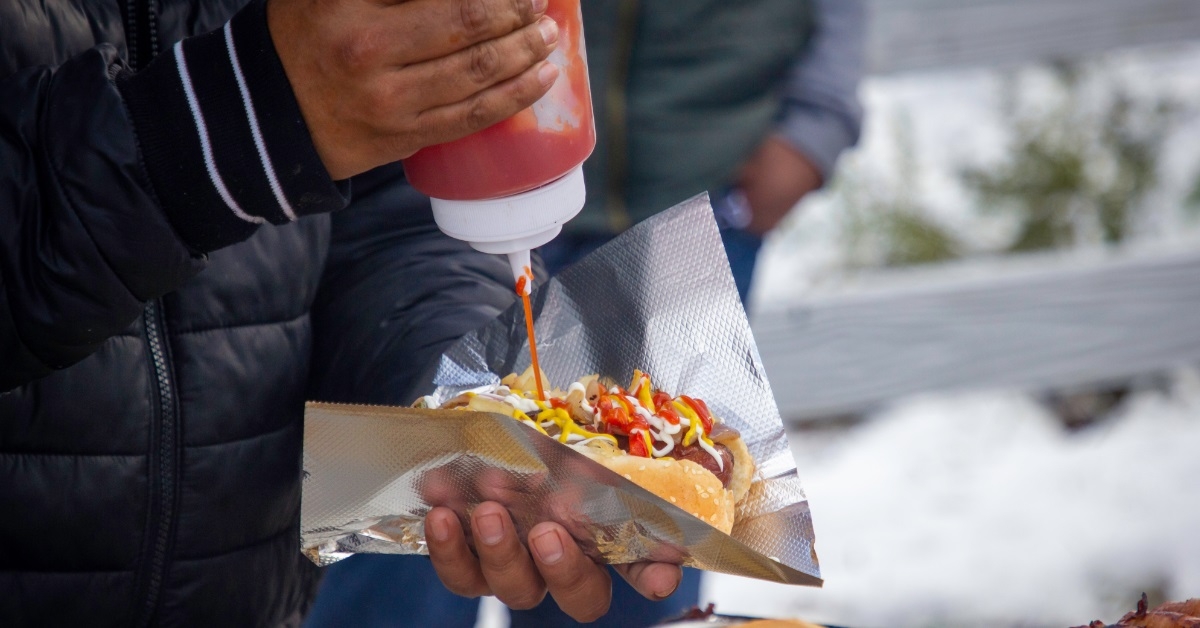 vender-putting-ketchup-on-hot-dog