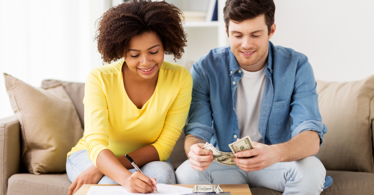 couple with papers and calculator