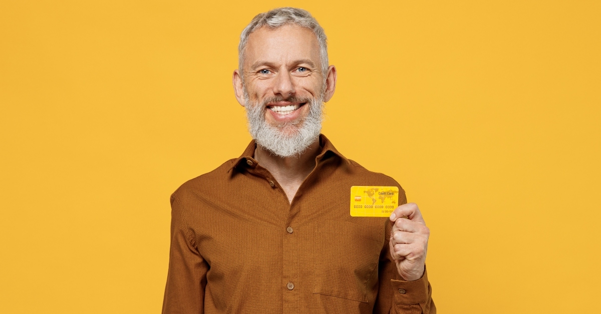 man holds credit bank card
