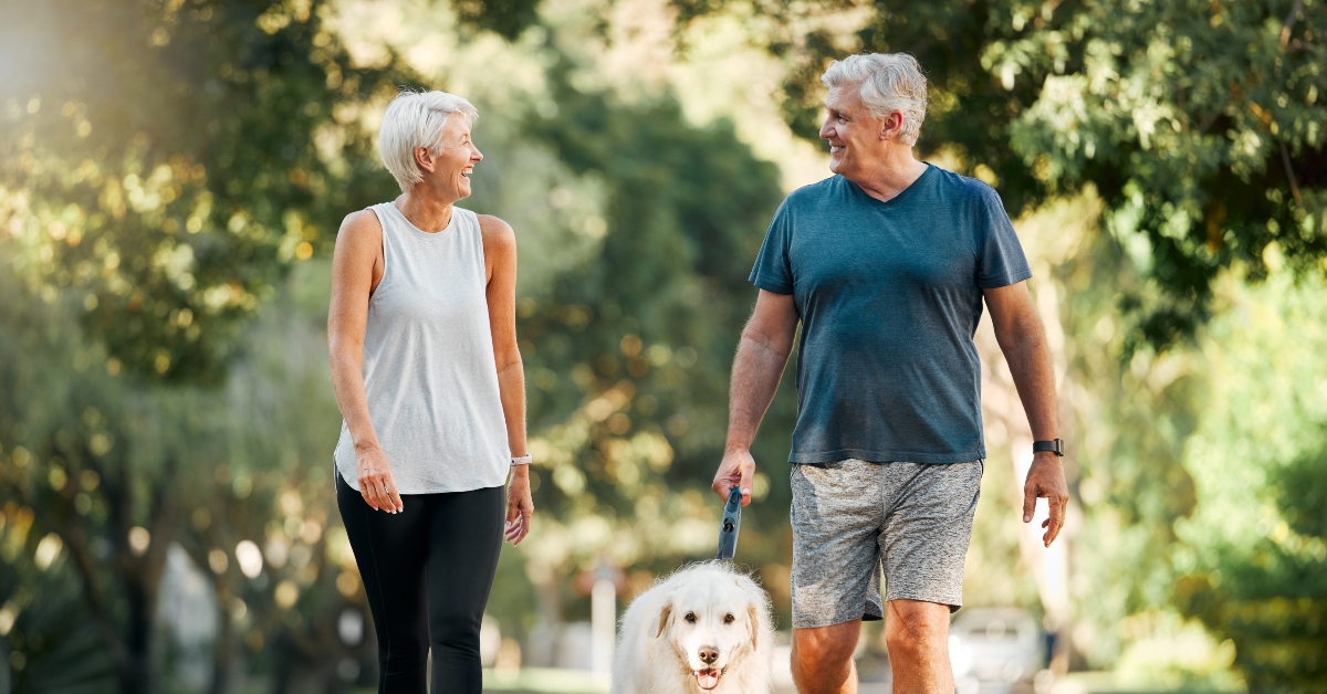 couple walking with dog