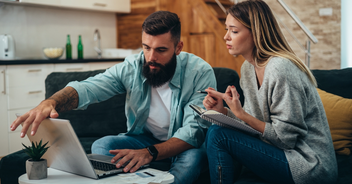 couple using a laptop for paying bills