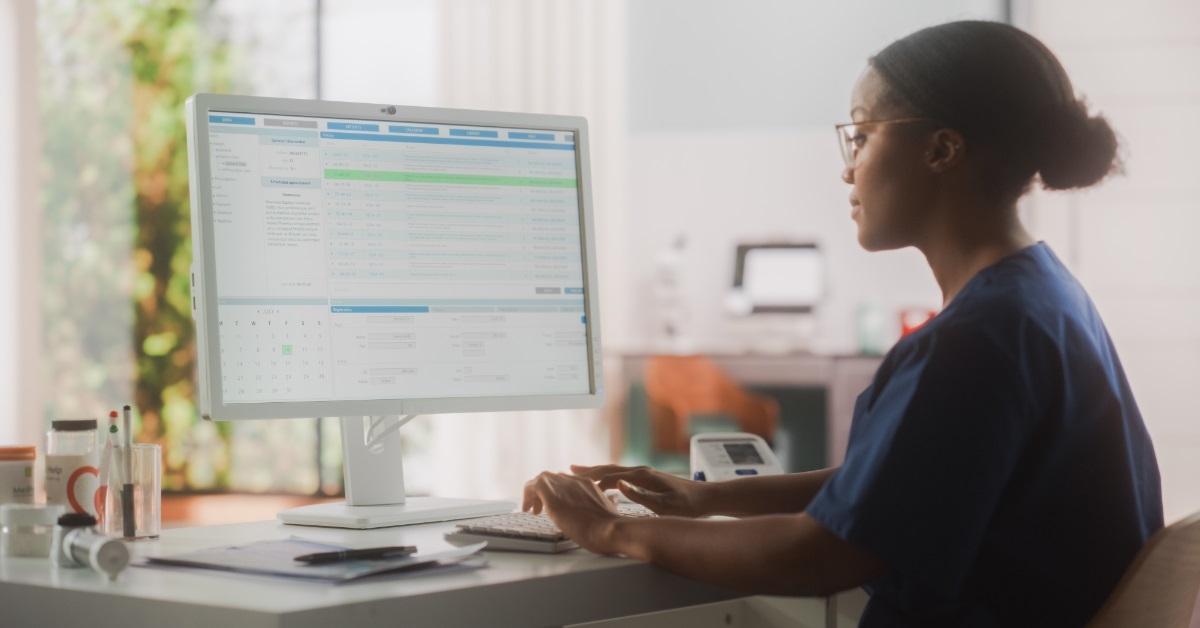 african american nurse using hospital computer
