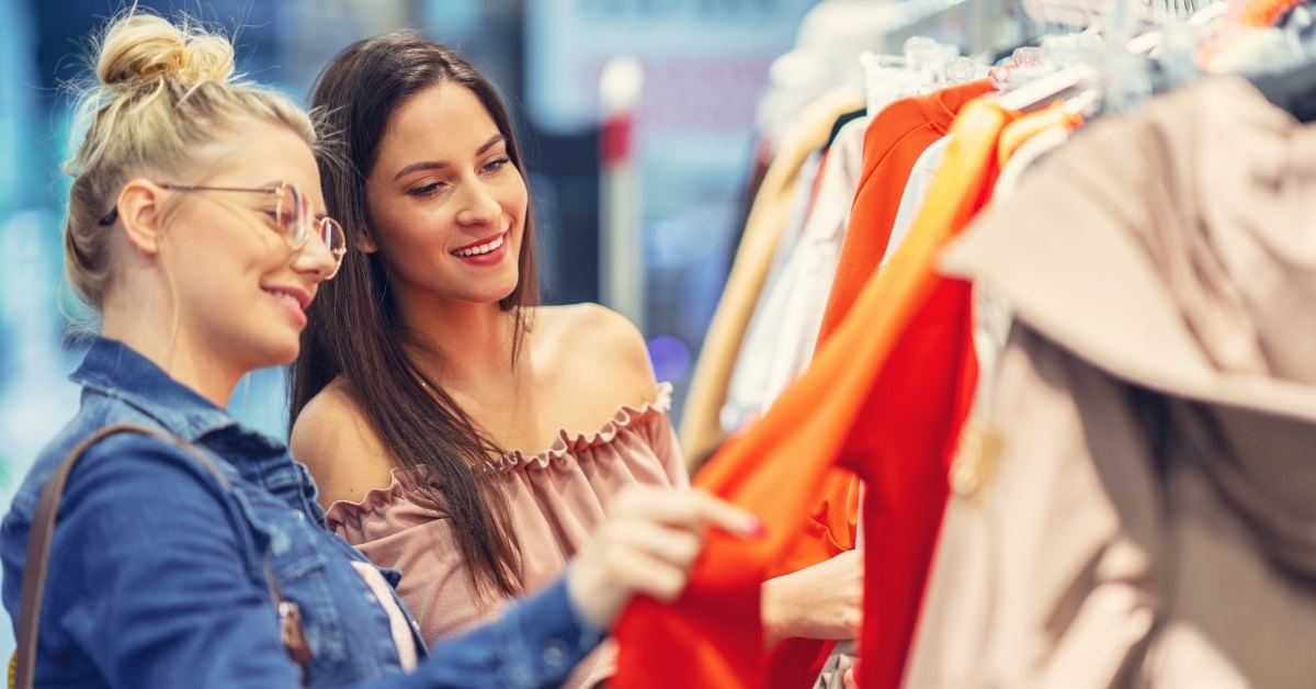 girl friends shopping for clothes