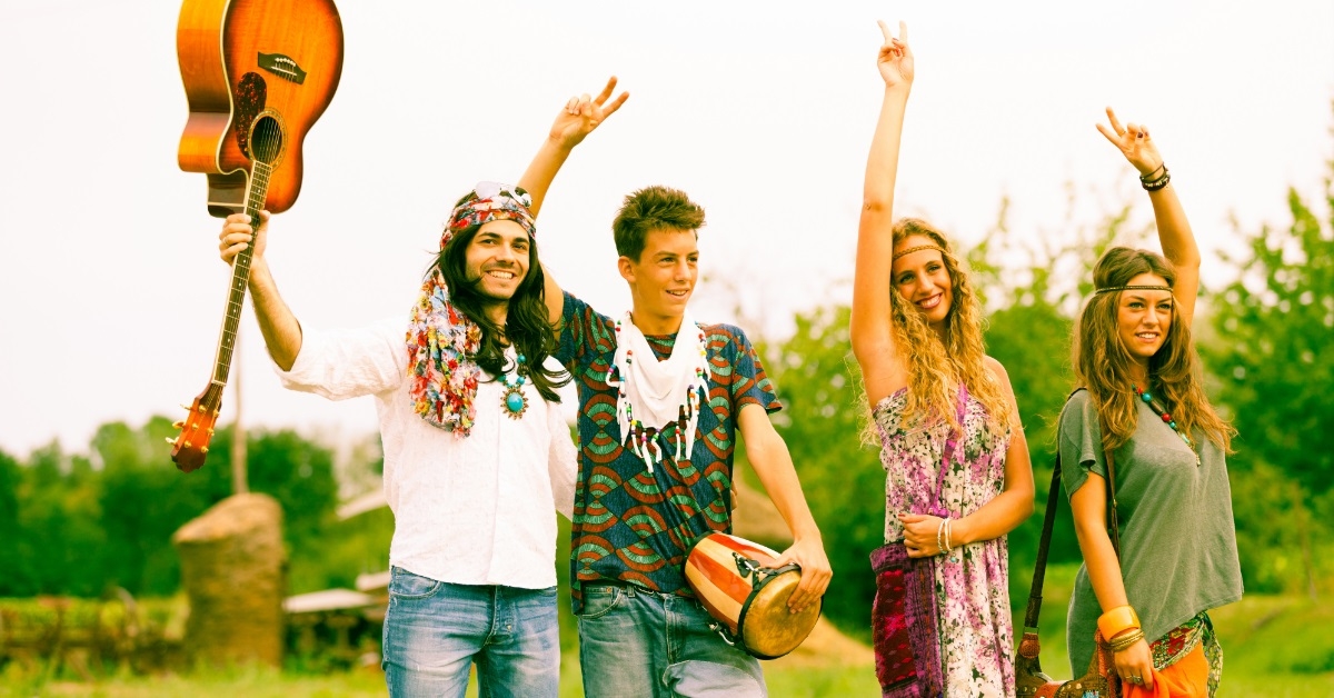 hippie group dancing in countryside