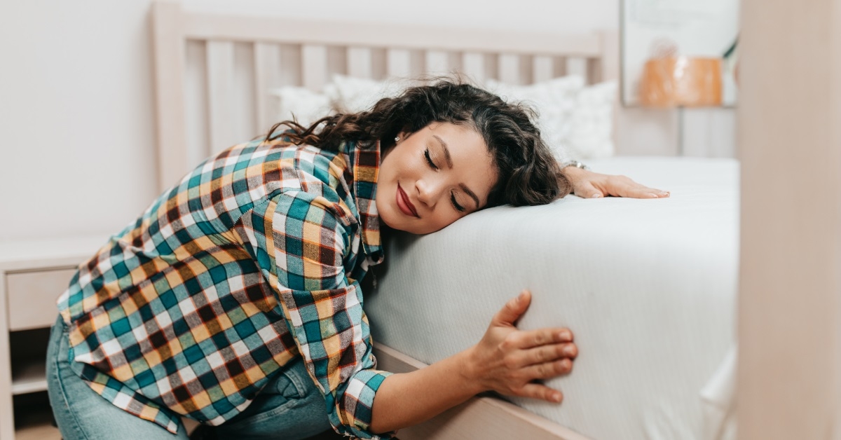 woman excited about fresh bed linen