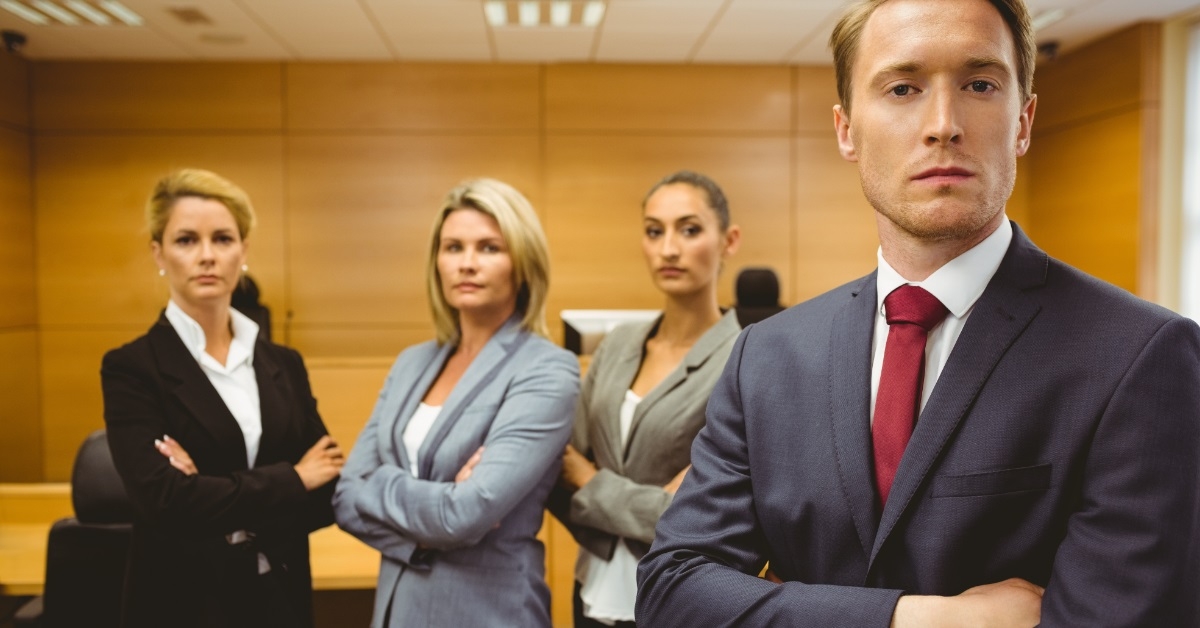 serious lawyers posing with arms crossed