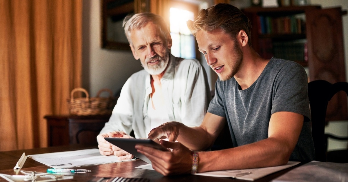 father and son calculating savings
