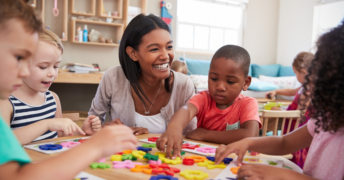 teacher and pupils using flower shapes