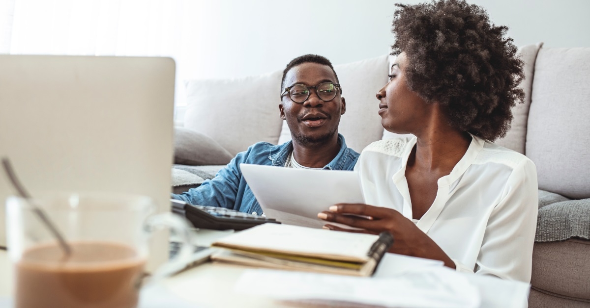 african american couple reviewing bills together