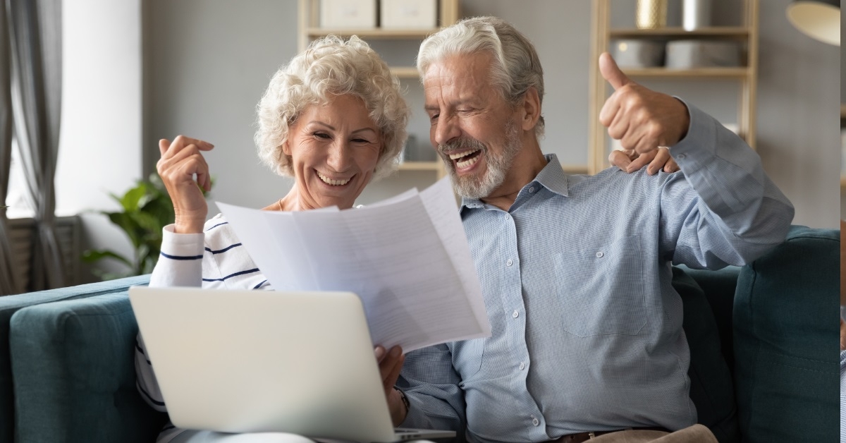 senior couple happy after clearing debt
