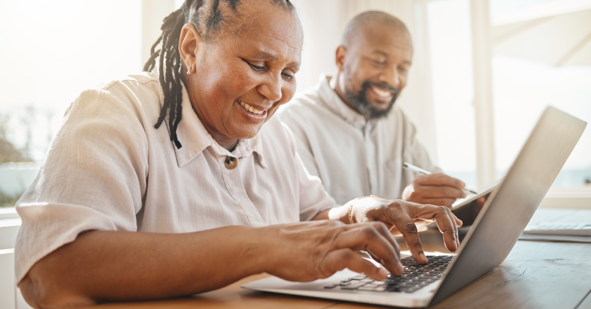 retired couple using laptop