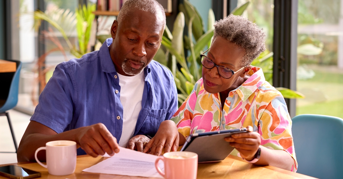 senior couple sitting around table