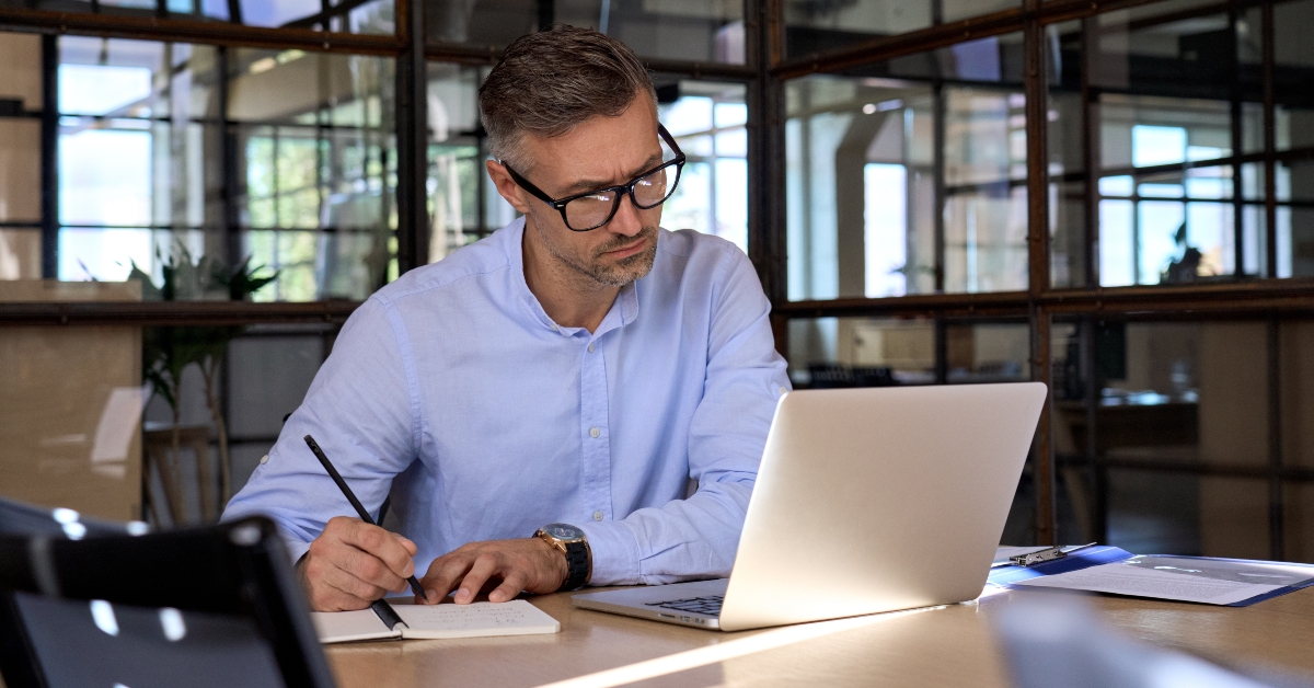 executive manager looking at laptop