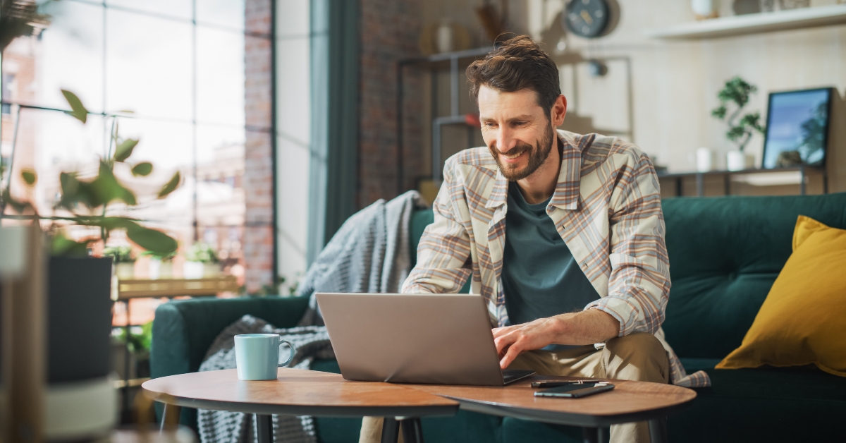 man working from home on a laptop