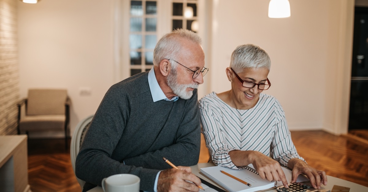 senior couple finalising budget for vacation