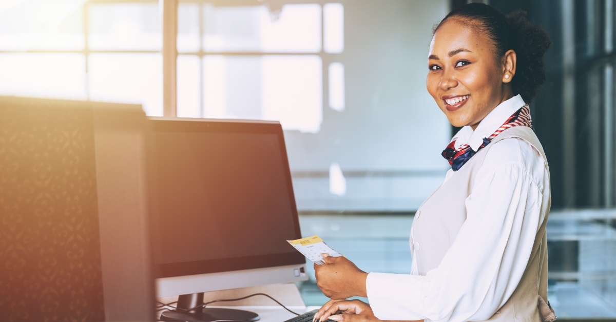 happy hostess at airline counter