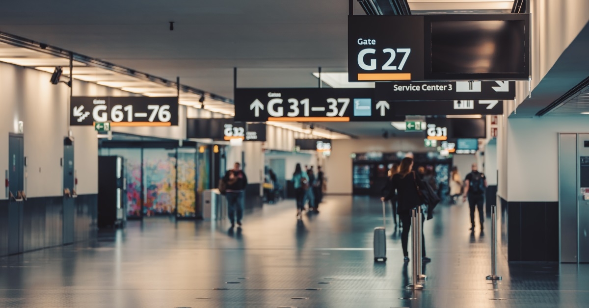 travelers walking in vienna airport terminal