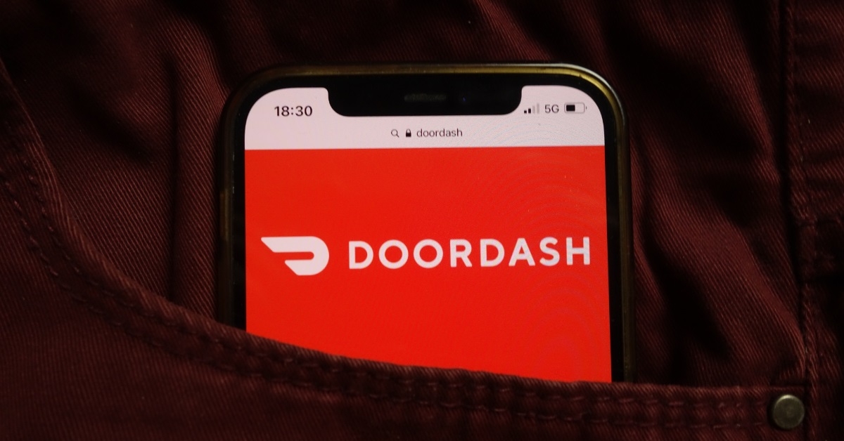 doordash logo on smartphone inside pocket