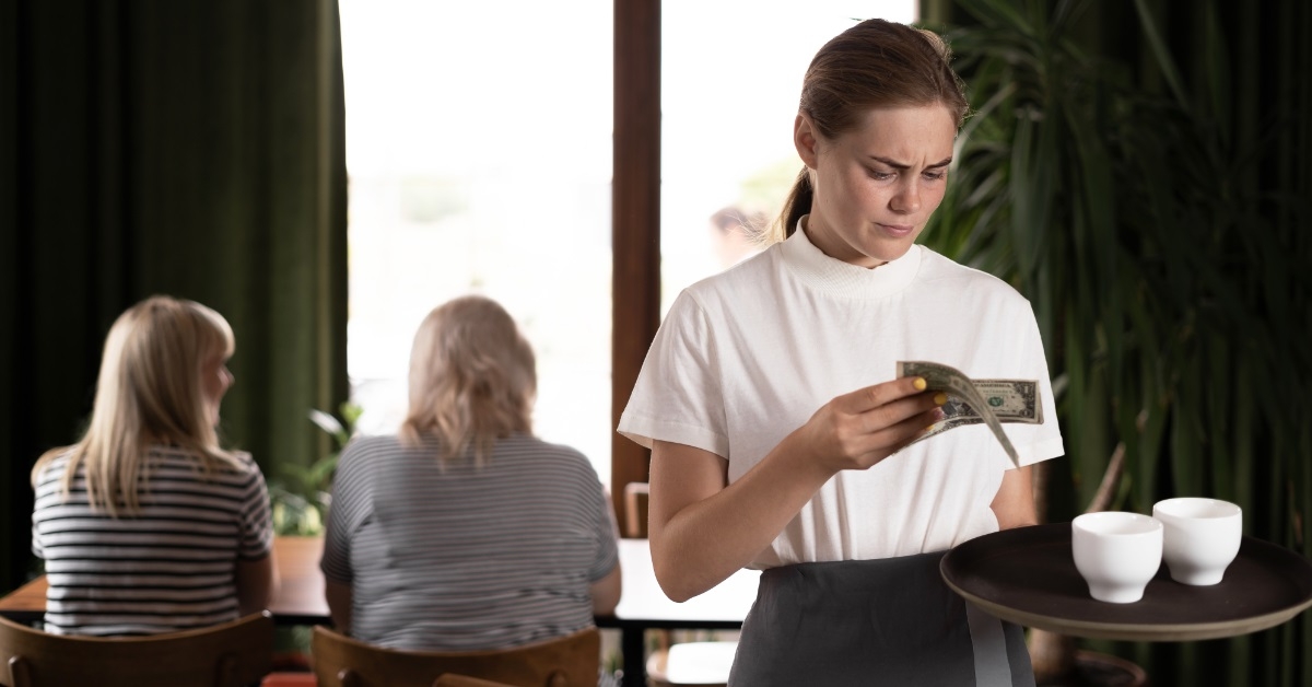 female waitress unhappy about tips received