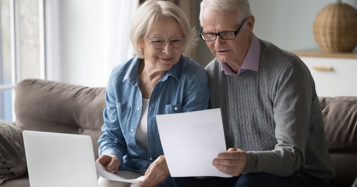 retired couple reading good news