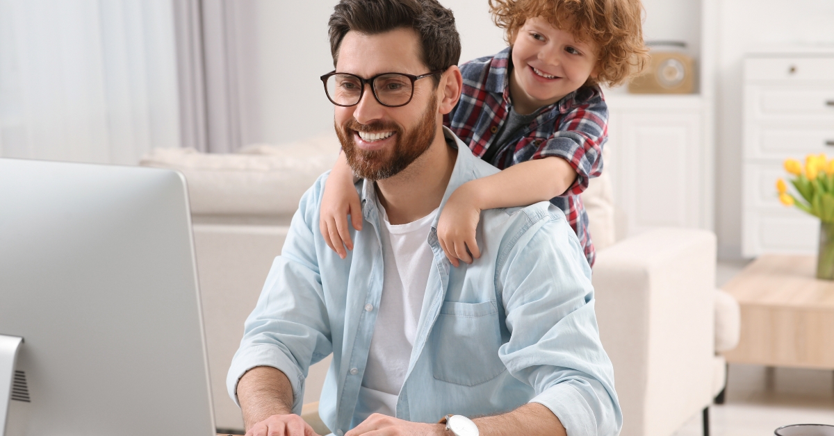 father with his child at desk